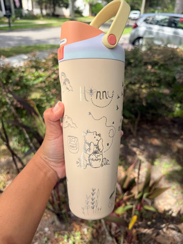 Cream Owala FreeSip Sway 30 oz tumbler laser engraved with a Winnie the Pooh-inspired design