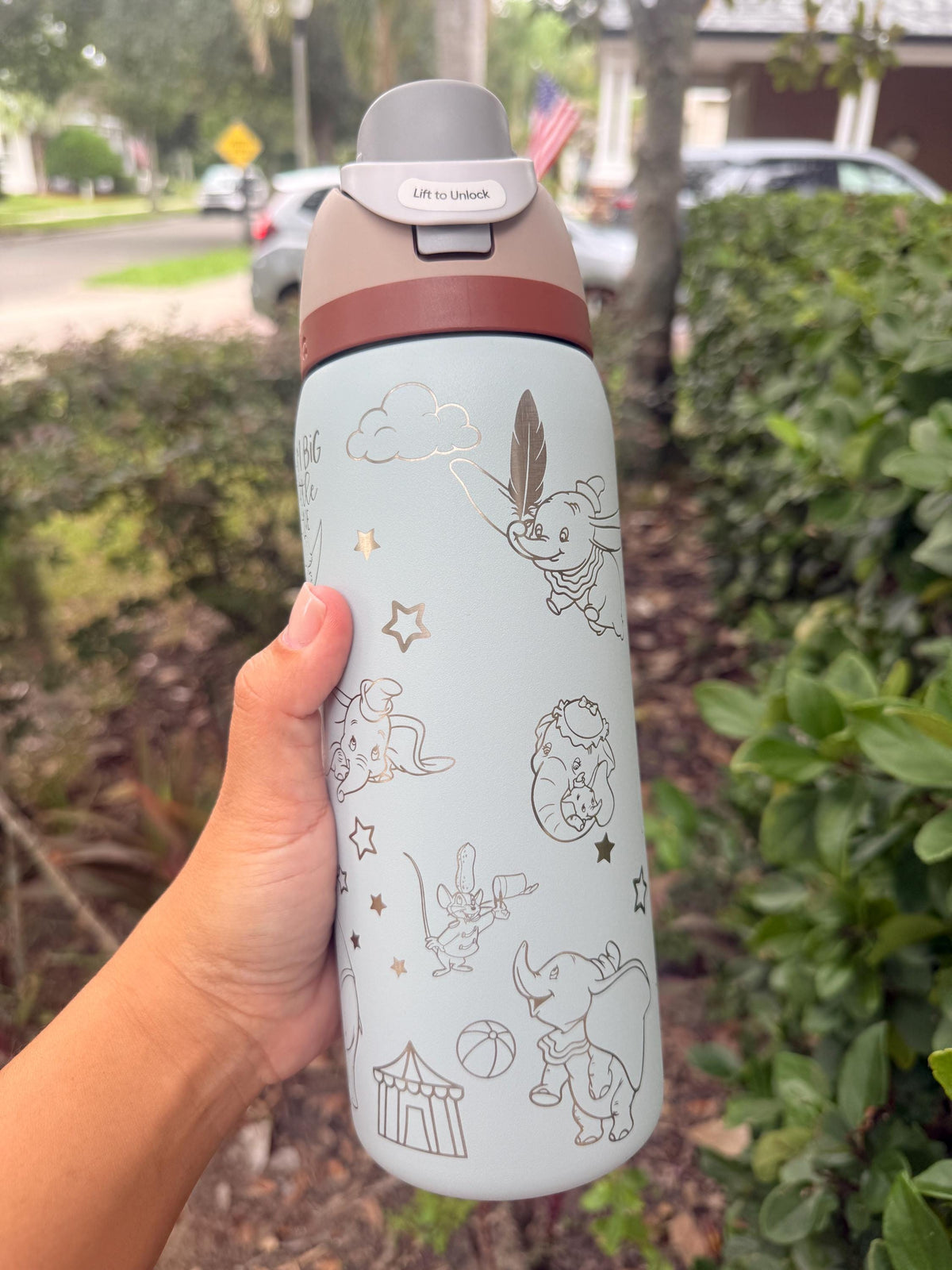 Light blue Owala FreeSip with engraved Timothy mouse and Dumbo details