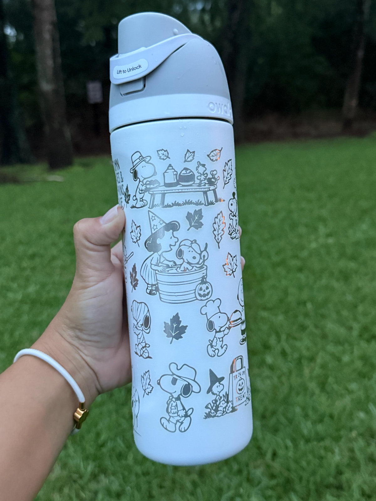 Snoopy with pumpkins and autumn leaves engraved on a light blue Owala